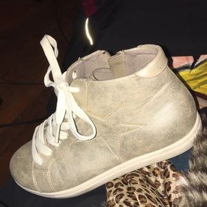 Glitter gold high top sneakers.